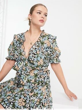 ASOS DESIGN Curve tie front mini dress with ruffle skirt in floral print